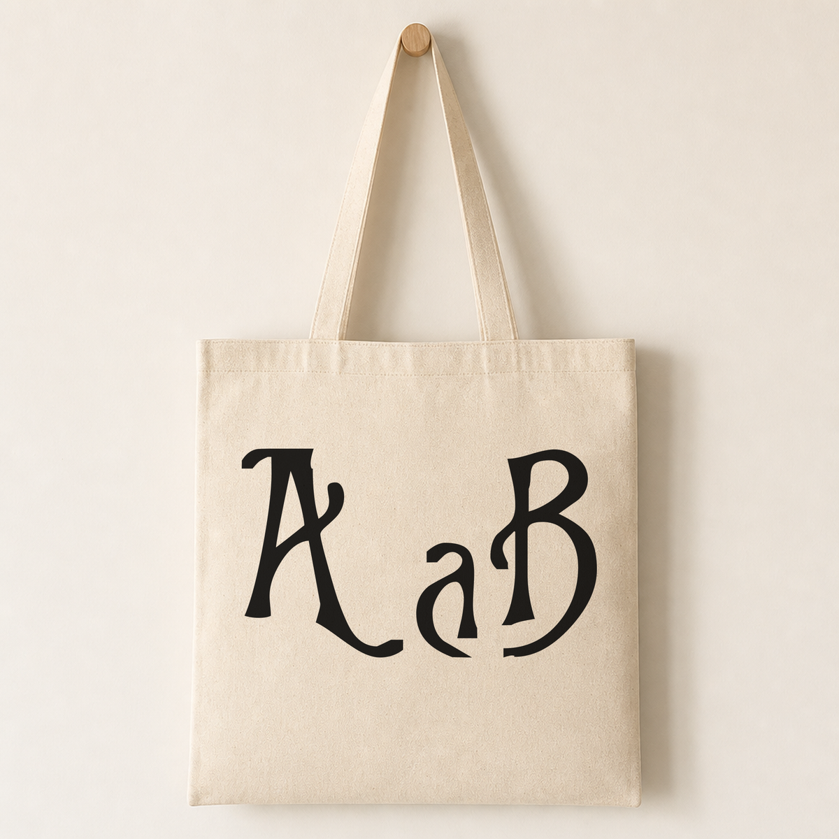Canvas tote bag mockup with a printed Nightmare-style letter from the set on the side