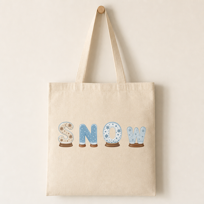 Canvas tote bag with a snow globe letter printed on the front, illustrating how the design looks on fabric.