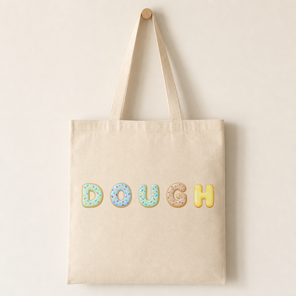Canvas tote bag printed with a single glossy-iced doughnut letter in pink-accented colours