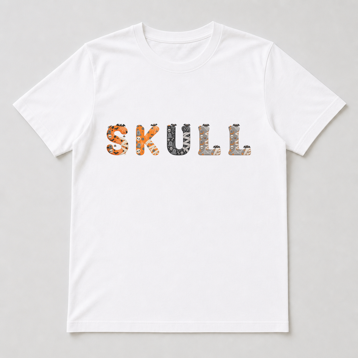 White t-shirt printed with a row of Skeleton Spooks characters, each including spider, web and mini-icon accents along the edges.