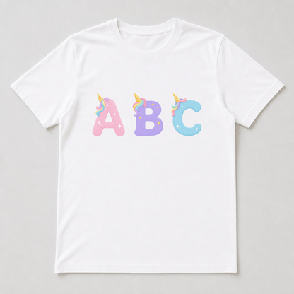 A white t-shirt with a unicorn capital letter printed on the chest, featuring the gold horn, pastel rainbow tuft and star sparkles.